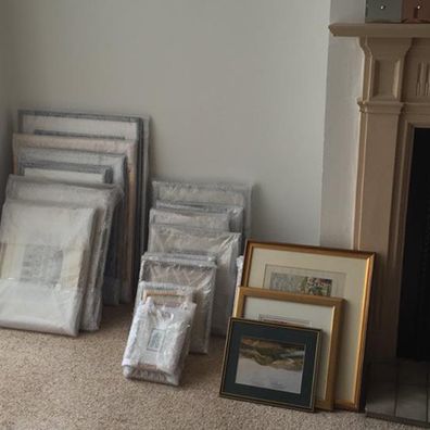 picture frames being bubble wrapped for a house move